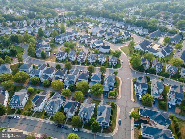 an aerial view of residential houses with outdoor space