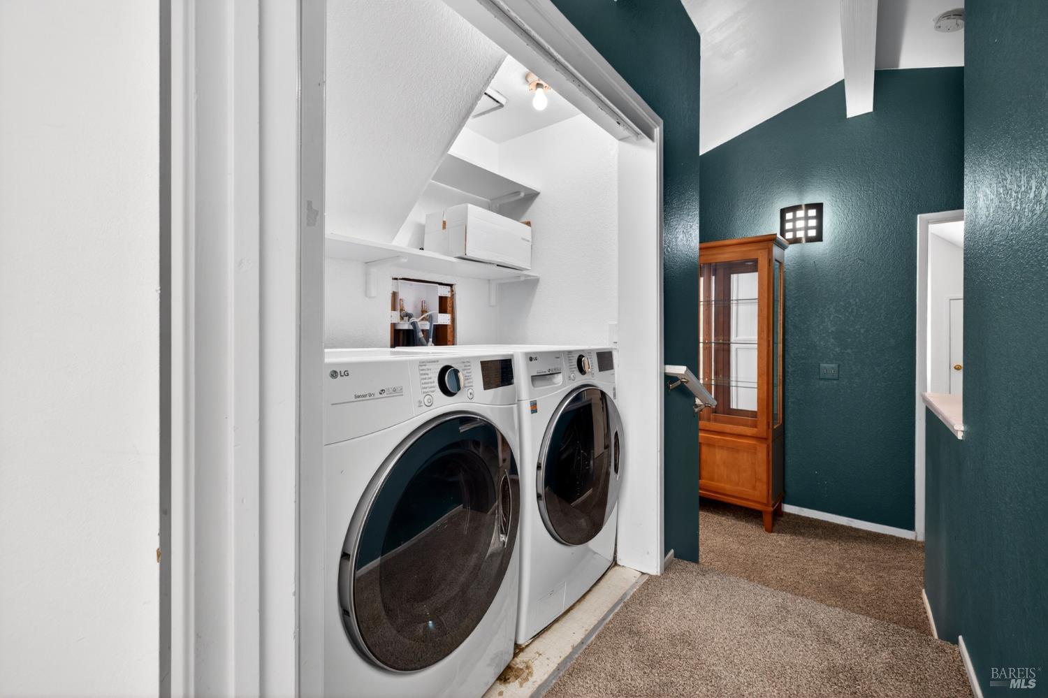 2757 Lakeview Drive Santa Rosa, CA 95405 - Photo 26 of 54 a view of a hallway with washer and dryer