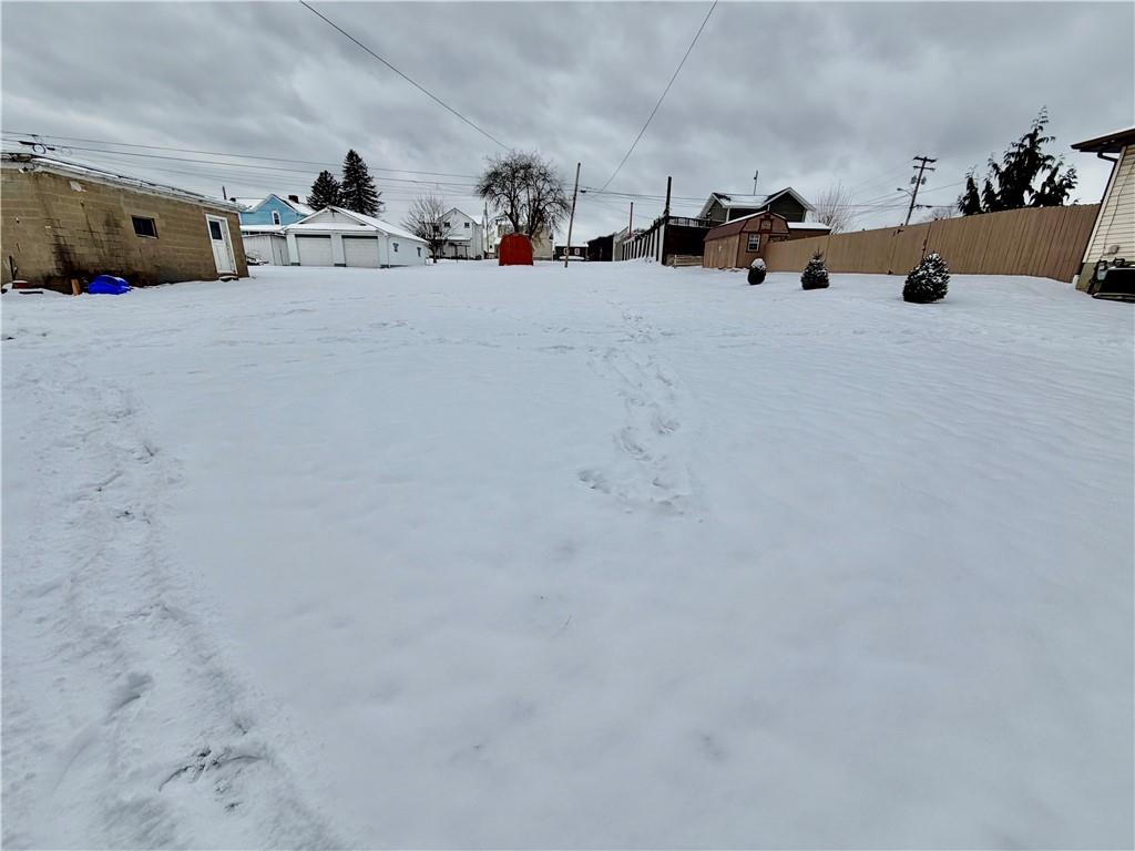 306 Cleveland Street Kittanning, PA 16201 - Photo 24 of 24 a view of the that has a bed and a chandelier