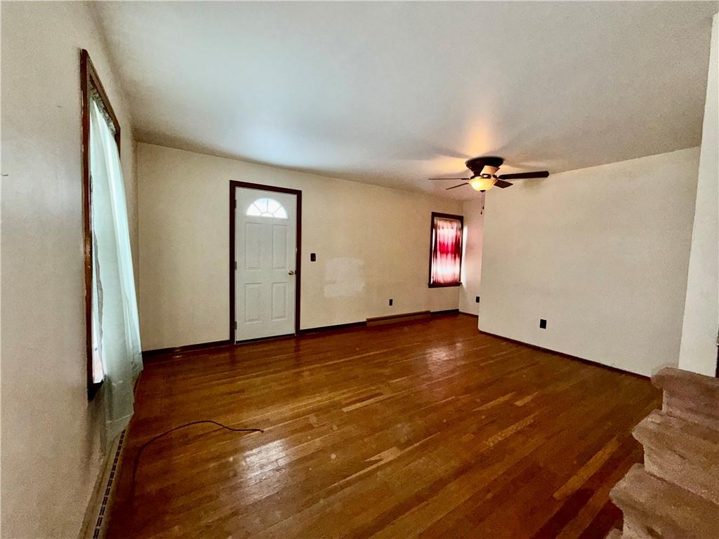 306 Cleveland Street Kittanning, PA 16201 - Photo 3 of 24 a view of empty room with wooden floor