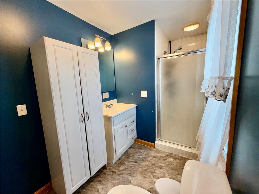 306 Cleveland Street Kittanning, PA 16201 - Photo 8 of 24 a bathroom with a sink toilet and shower