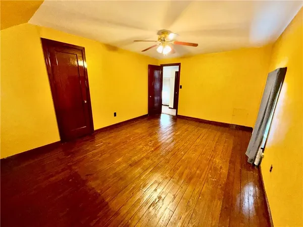 a view of entryway with wooden floor