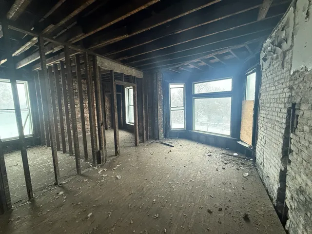 a view of empty room with windows
