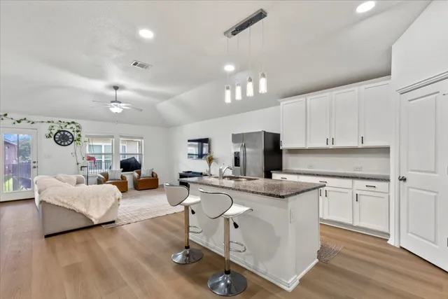 a view of a kitchen counter space with stainless steel appliances granite countertop furniture and a counter top space