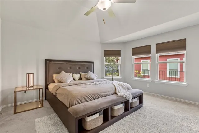 a bedroom with bed and a window