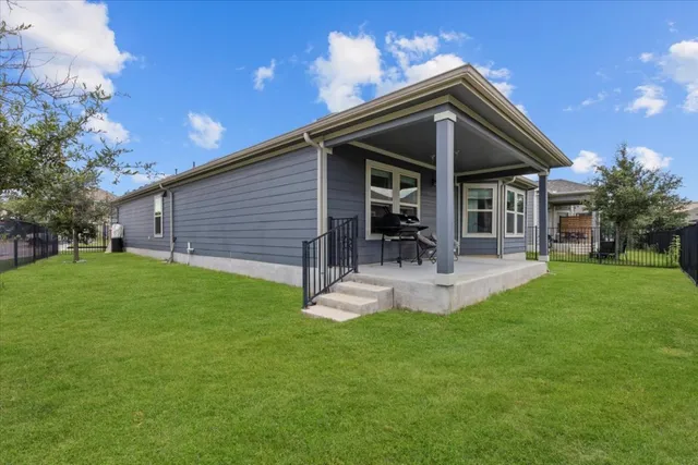 a aerial view of a house with a yard