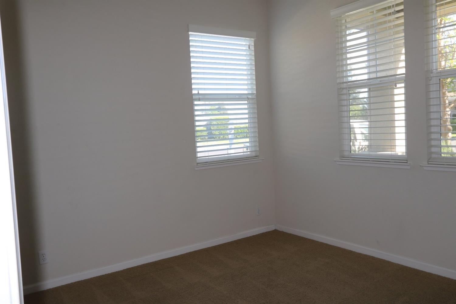 1709 Thomas Court Modesto, CA 95355 - Photo 4 of 11 an empty room with a window
