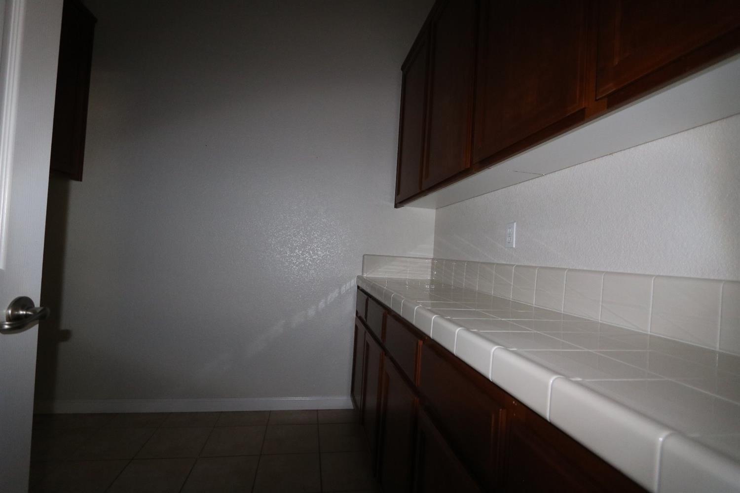 1709 Thomas Court Modesto, CA 95355 - Photo 9 of 11 a kitchen with a sink and cabinets