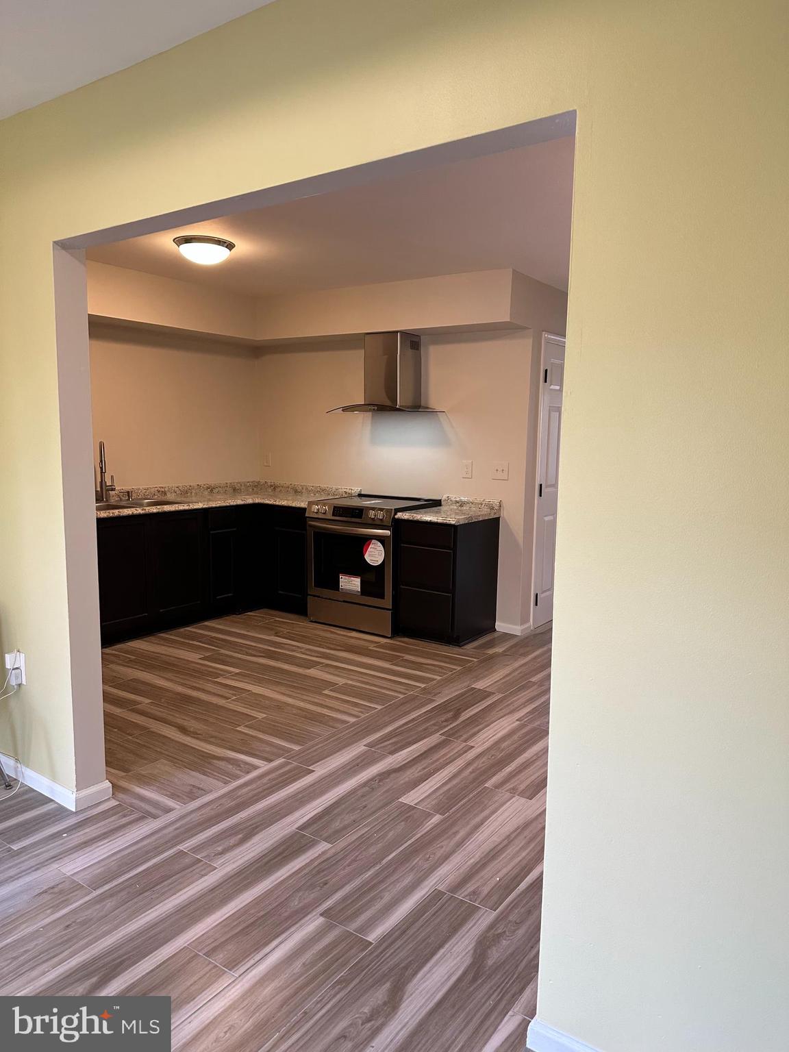 107 North Church Street Charles Town, WV 25414 - Photo 12 of 26 a bathroom with a sink and a mirror