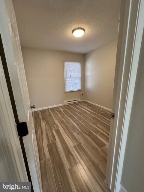 107 North Church Street Charles Town, WV 25414 - Photo 17 of 26 a view of empty room with wooden floor