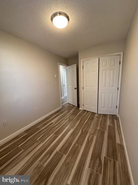 107 North Church Street Charles Town, WV 25414 - Photo 19 of 26 a view of a room with wooden floor