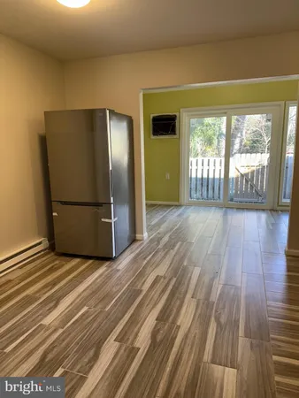 a view of a livingroom with wooden floor