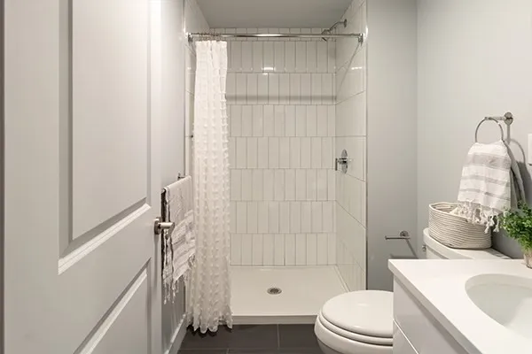a bathroom with a sink toilet and shower