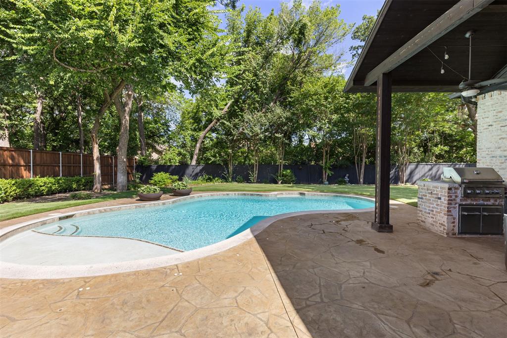 609 Seville Road Denton, TX 76205 - Photo 34 of 40 Inviting in-ground gunite pool with sunning shelf.