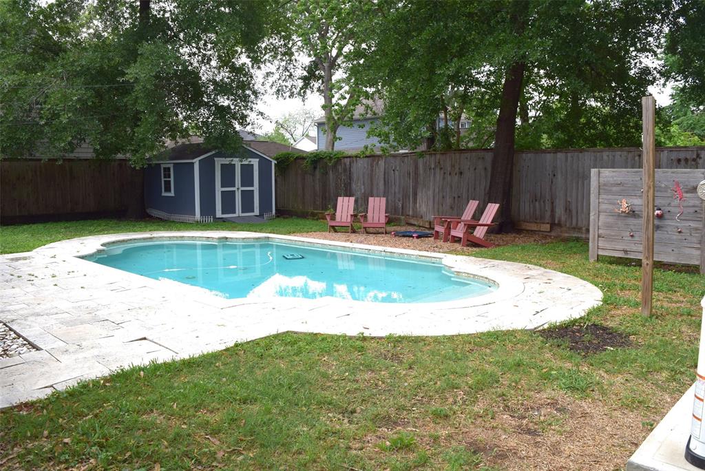 a view of a swimming pool with a sitting area