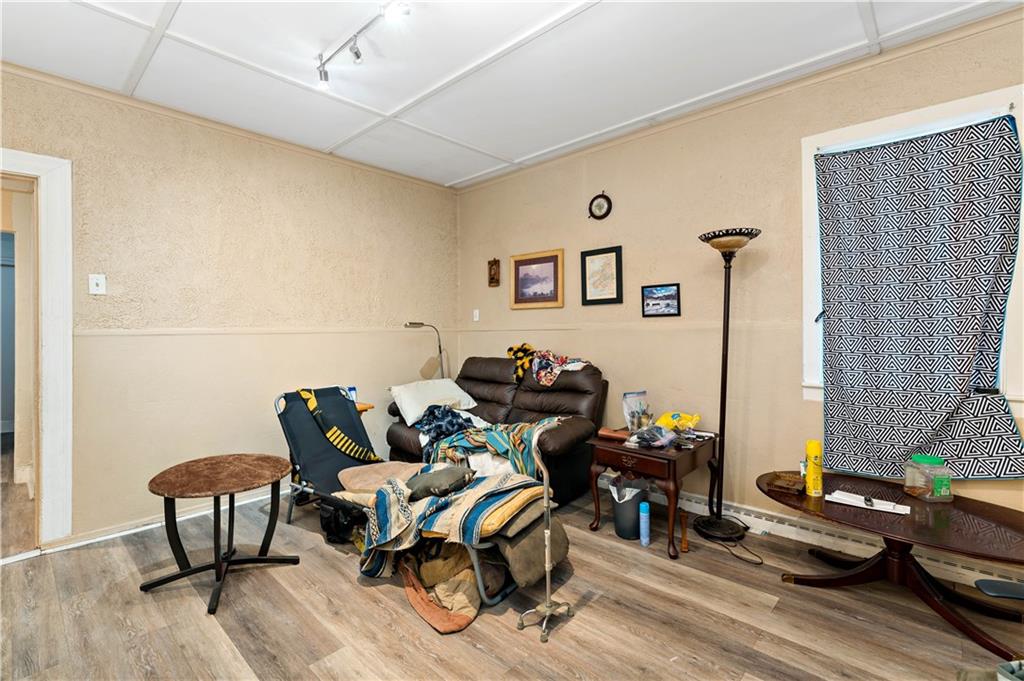 301 1st Avenue Carnegie, PA 15106 - Photo 15 of 40 a living room with furniture and a wooden floor