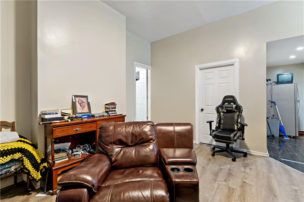 301 1st Avenue Carnegie, PA 15106 - Photo 18 of 40 a living room with furniture and a mirror