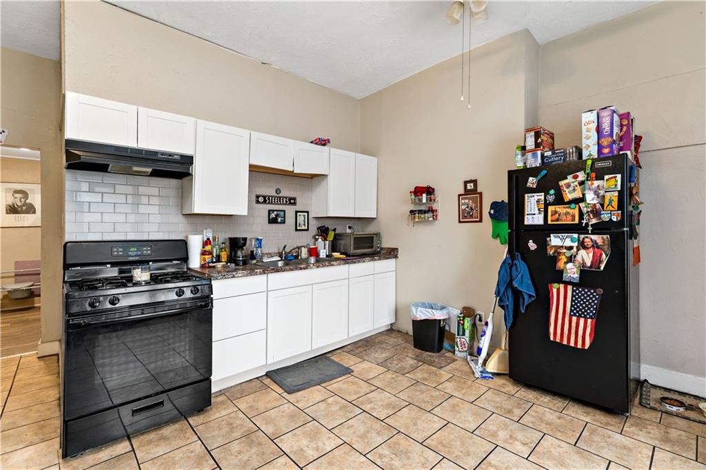 301 1st Avenue Carnegie, PA 15106 - Photo 25 of 40 a kitchen with stainless steel appliances granite countertop a refrigerator and a sink