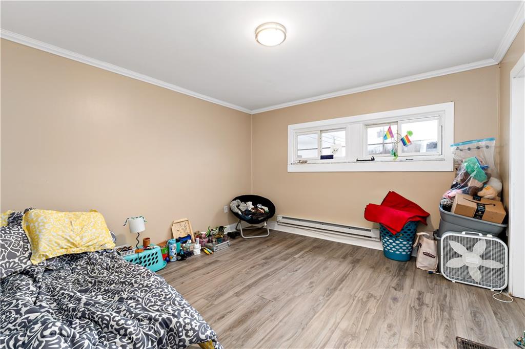 301 1st Avenue Carnegie, PA 15106 - Photo 27 of 40 a bedroom with furniture and a painting on the wall