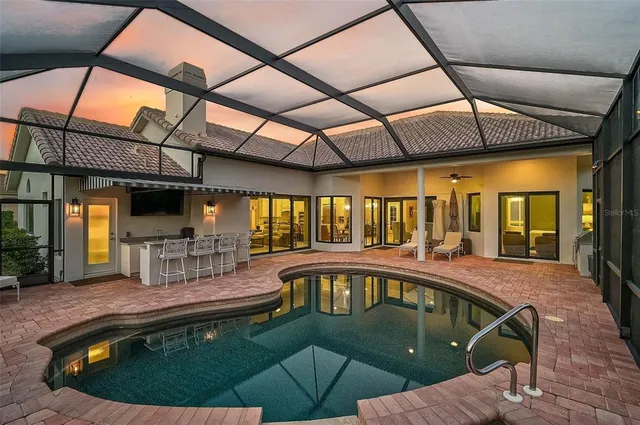 a view of a swimming pool with seating area