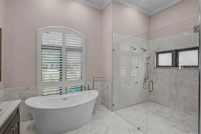 a bathroom with a granite countertop toilet sink and a mirror