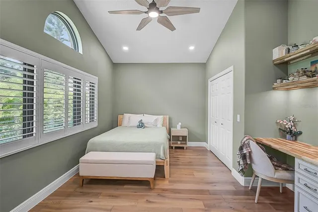 a view of a patio with a table and chairs under an umbrella