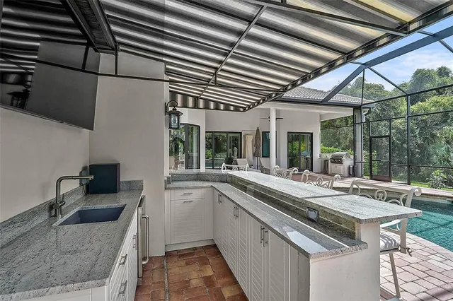 a view of a hallway with a black and white checkered floor