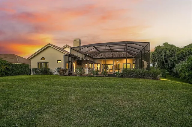 a view of a living room with furniture and garden view