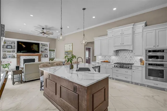 a large kitchen with a table and chairs
