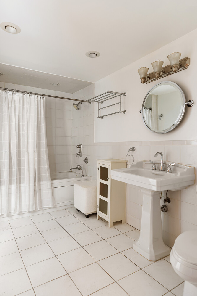 490 Monroe Street Brooklyn, NY 11221 - Photo 12 of 15 a bathroom with a sink toilet and shower