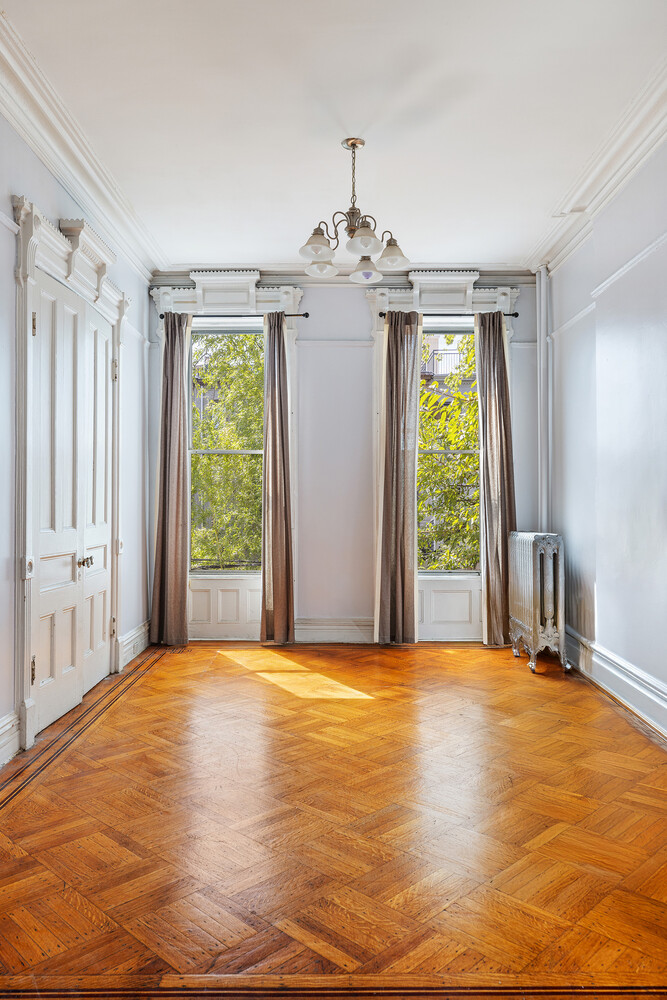 490 Monroe Street Brooklyn, NY 11221 - Photo 9 of 15 a view of an empty room with a window