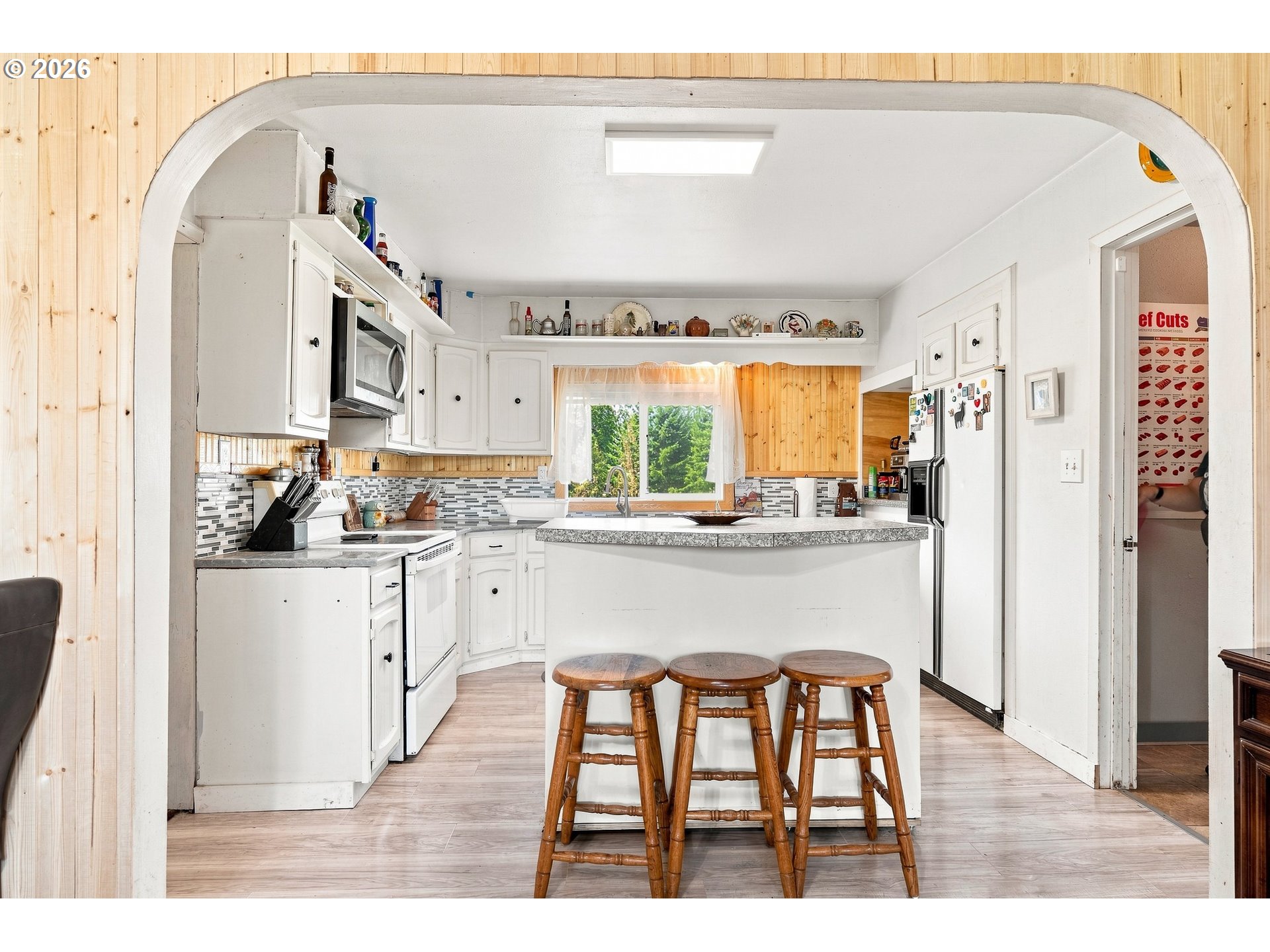 68763 Wasser Road Rainier, OR 97048 - Photo 6 of 42 a living room with stainless steel appliances kitchen island granite countertop furniture and a large window