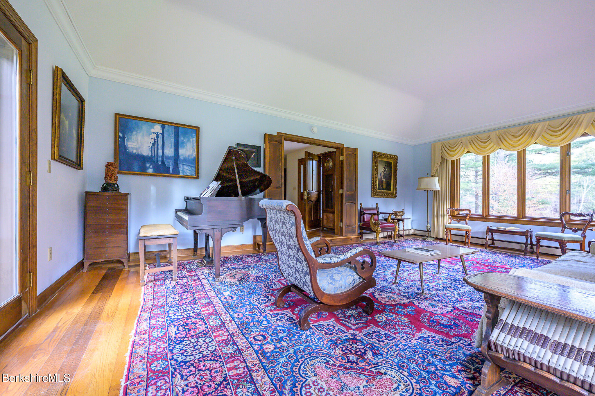 462 E Road Richmond, MA 01254 - Photo 11 of 49 a living room with furniture a rug and a floor to ceiling window