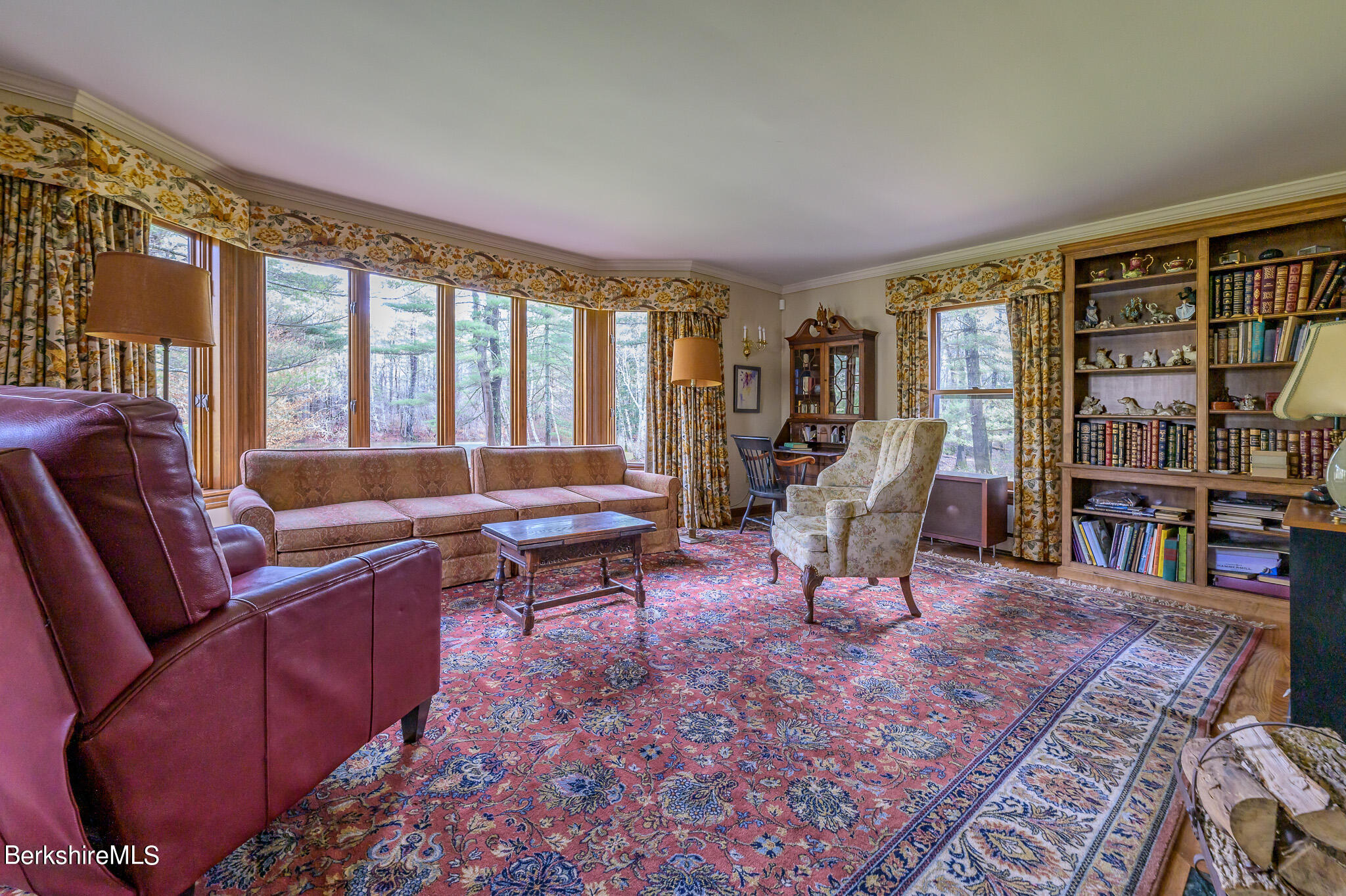 462 E Road Richmond, MA 01254 - Photo 17 of 49 a living room with furniture and a book shelf