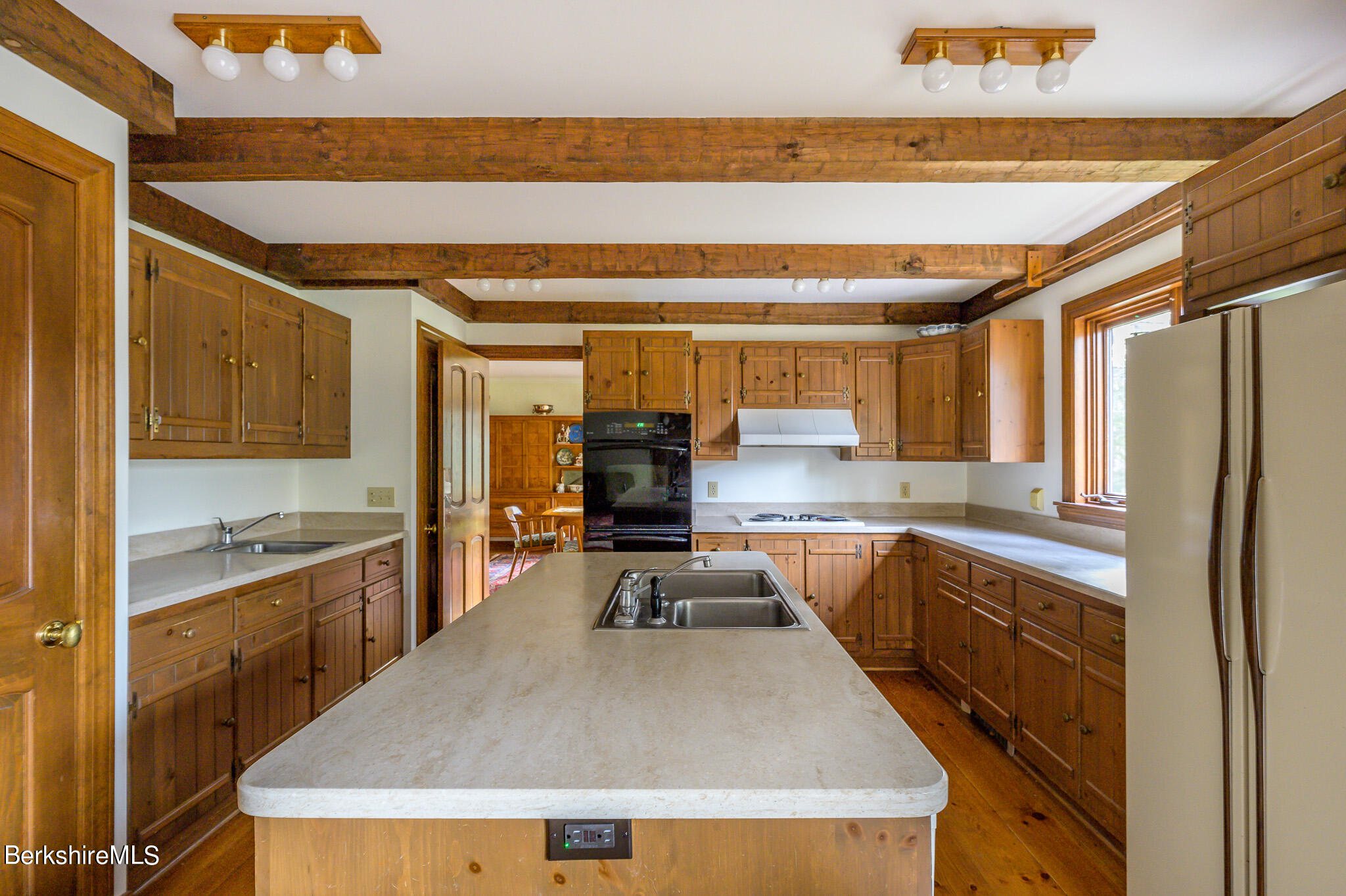 462 E Road Richmond, MA 01254 - Photo 21 of 49 a kitchen with a stove a sink and a refrigerator