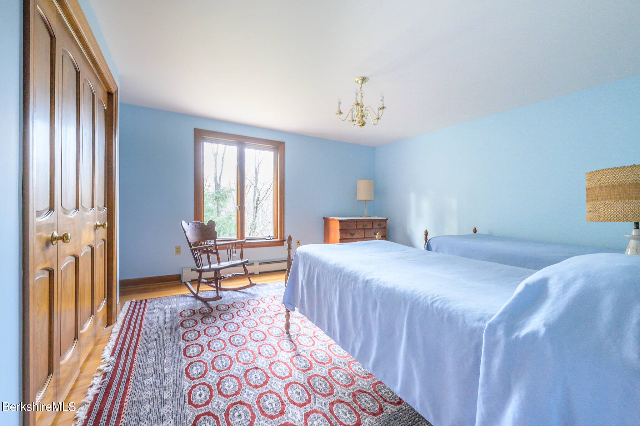 462 E Road Richmond, MA 01254 - Photo 30 of 49 a bedroom with a bed and wooden floor