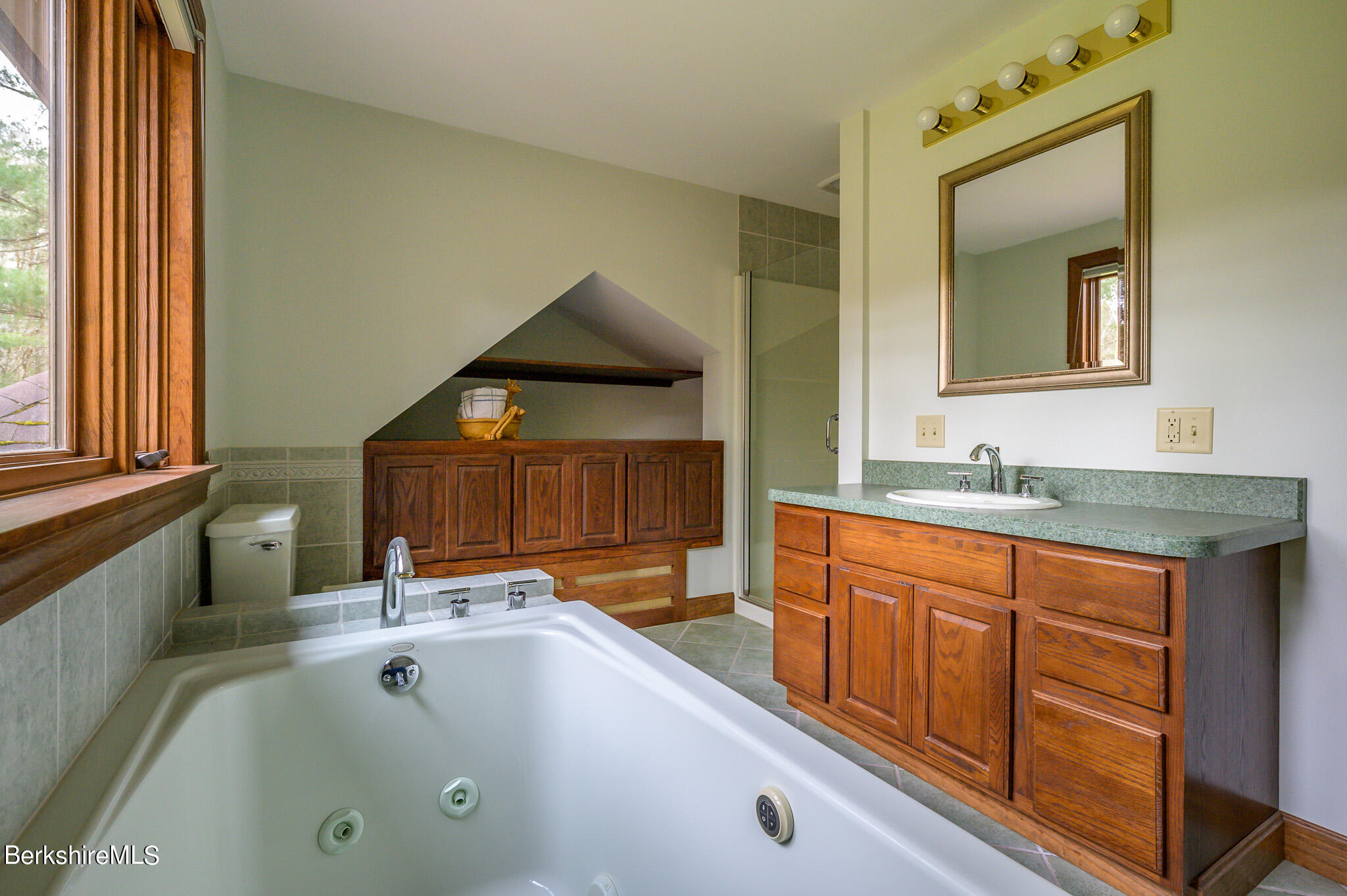 462 E Road Richmond, MA 01254 - Photo 31 of 49 a bathroom with a tub sink and mirror