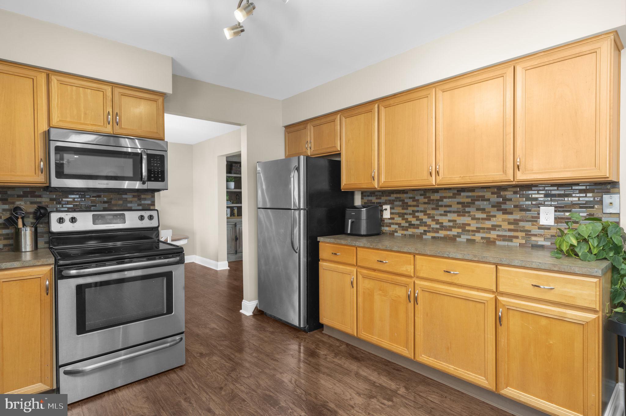150 Nectar Run Telford, PA 18969 - Photo 12 of 41 a kitchen with granite countertop white cabinets and stainless steel appliances