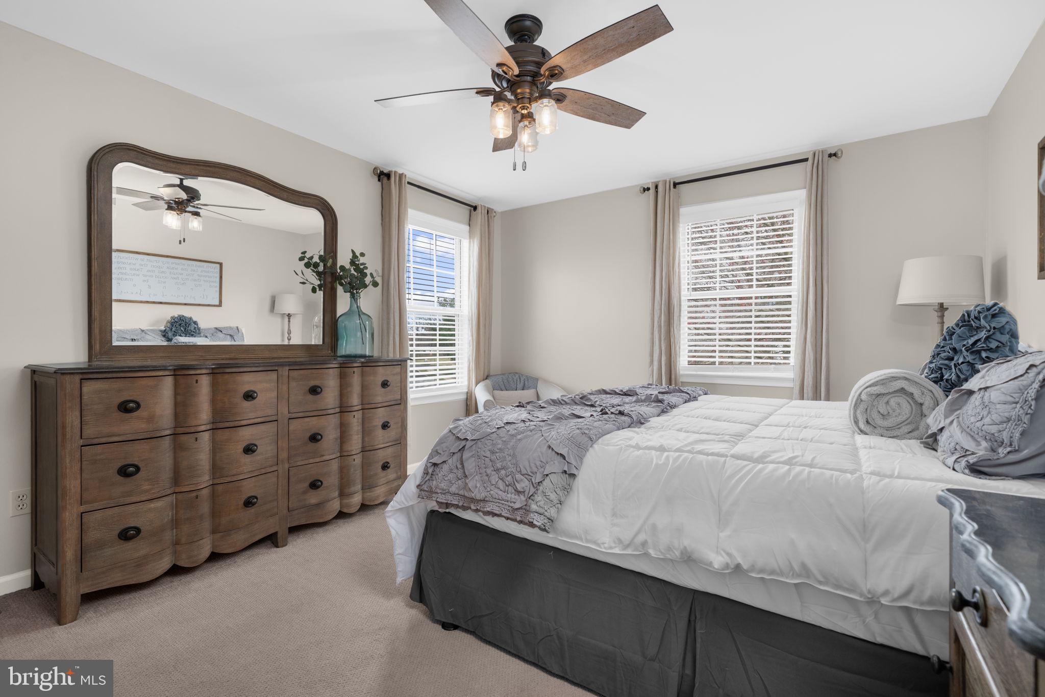 150 Nectar Run Telford, PA 18969 - Photo 20 of 41 a bedroom with a bed a chandelier and dresser