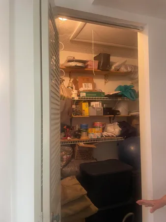 a room with water heater and a window