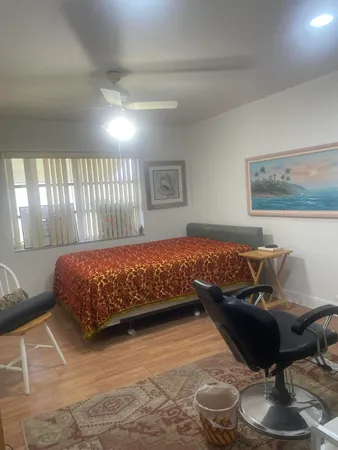 a bedroom with a bed and a couch
