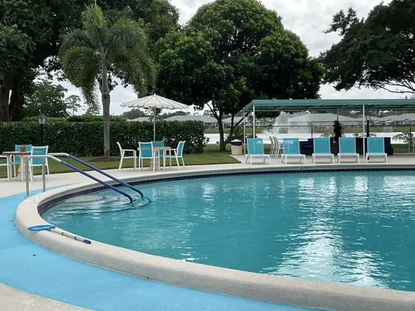 a view of a swimming pool with a patio