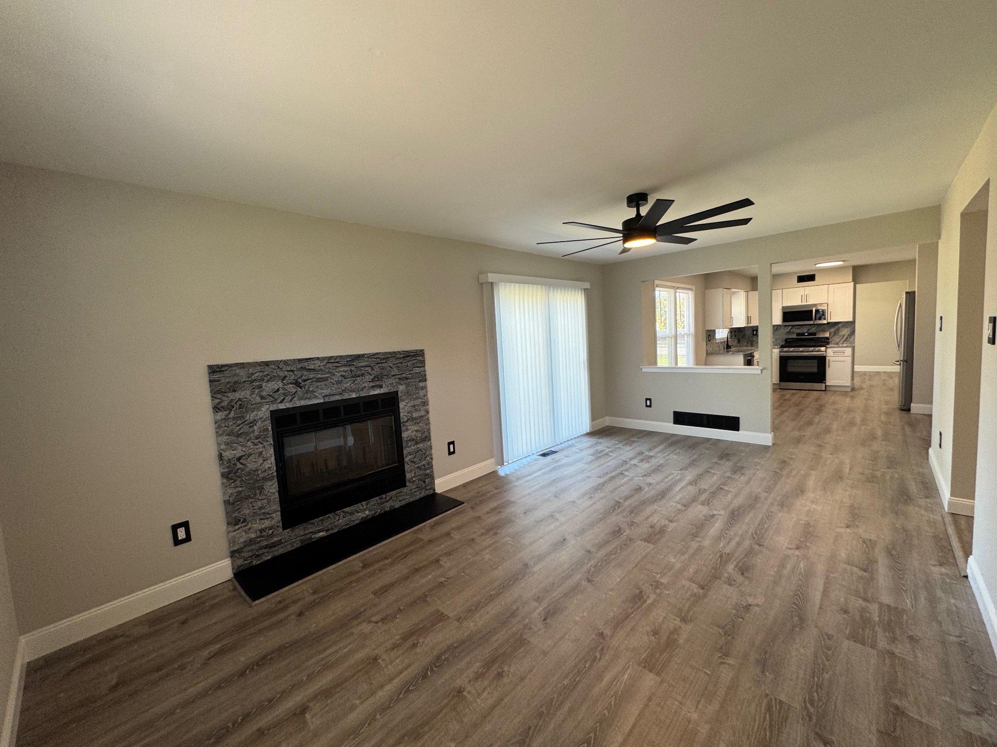 8 Framingham Road Beverly, NJ 08010 - Photo 9 of 35 Modern living space with cozy fireplace.