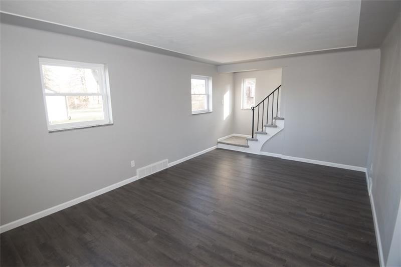 218 McClure Road Cheswick, PA 15024 - Photo 2 of 25 Inviting 18x11 living room with lots of wall space for furniture.