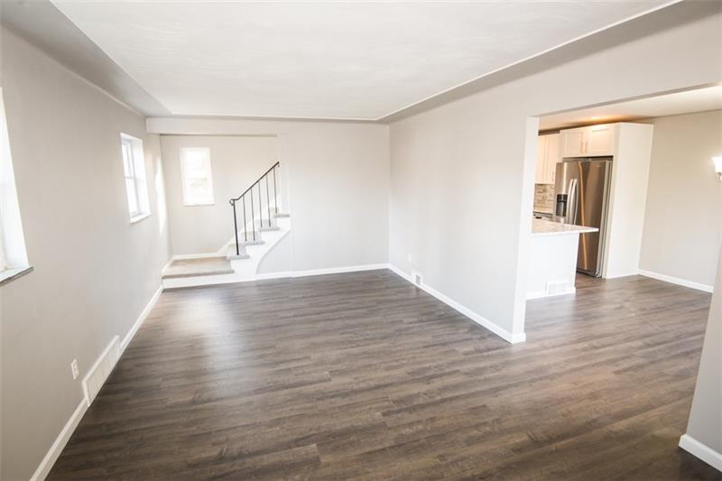 218 McClure Road Cheswick, PA 15024 - Photo 5 of 25 Additional view of the living room opening to the dining room and kitchen.