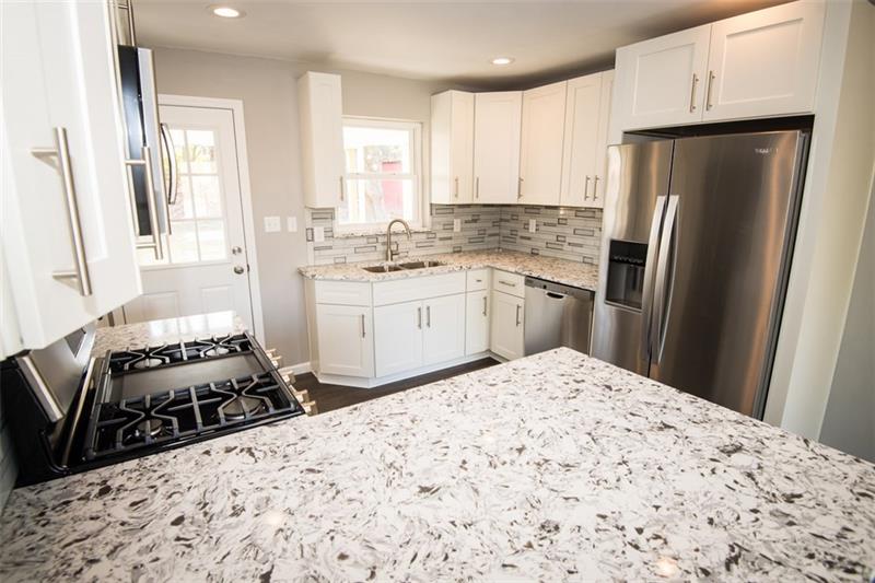 218 McClure Road Cheswick, PA 15024 - Photo 8 of 25 Large peninsula island perfect for seating or serving food.