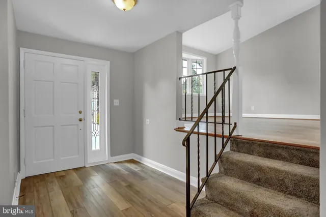 a view of entryway with wooden floor