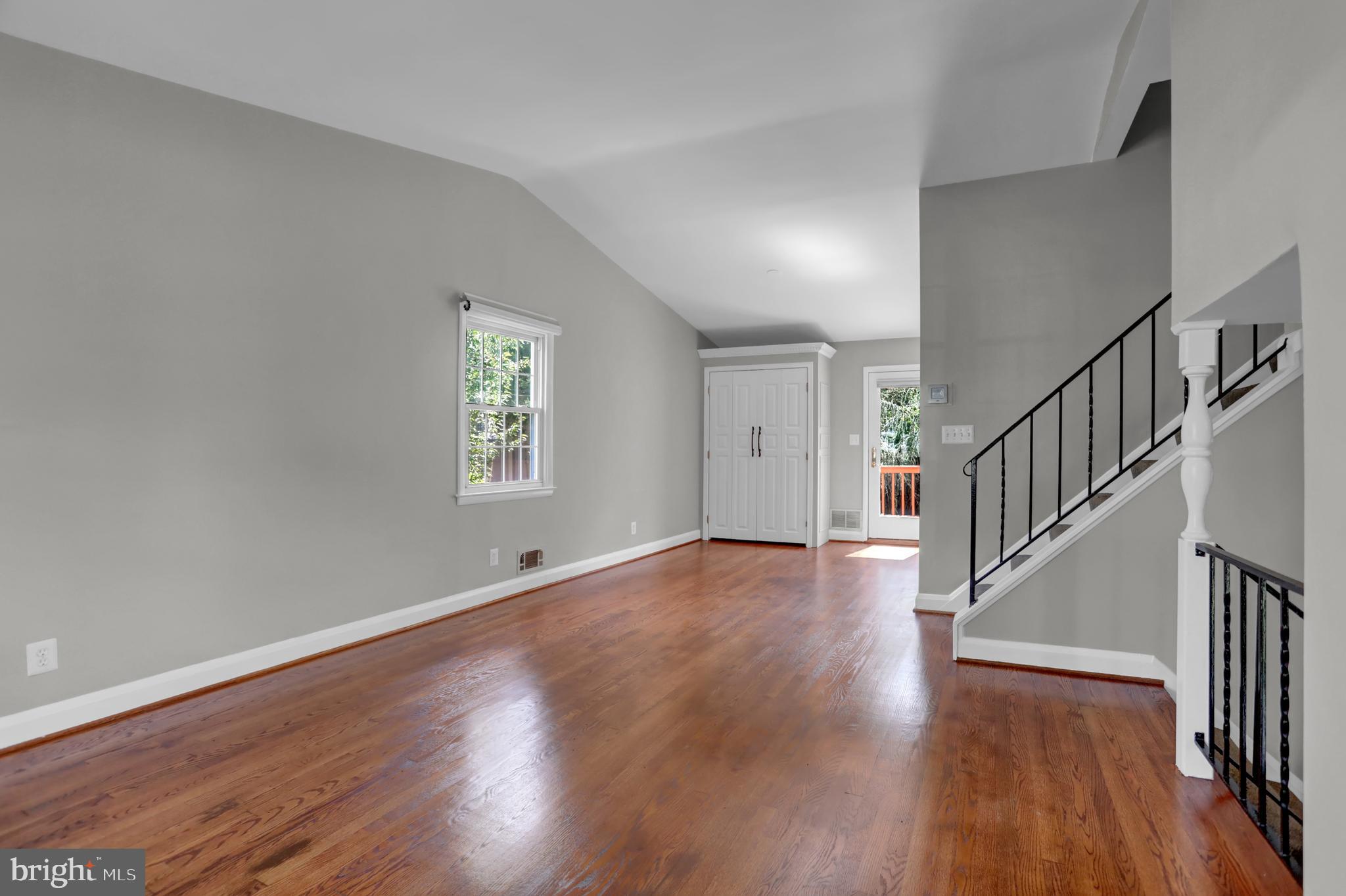 829 Kellogg Road Lutherville-Timonium, MD 21093 - Photo 19 of 42 a view of an empty room with wooden floor and stairs