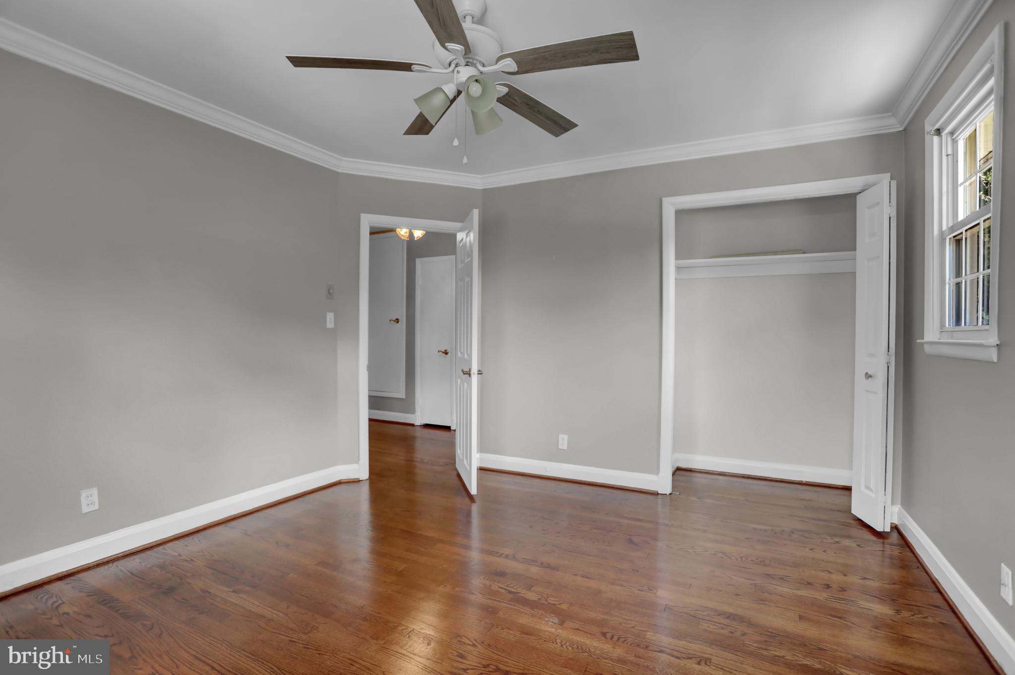 829 Kellogg Road Lutherville-Timonium, MD 21093 - Photo 22 of 42 an empty room with wooden floor closet and windows