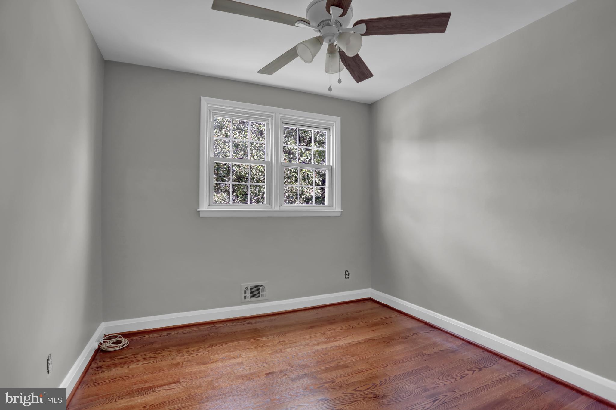 829 Kellogg Road Lutherville-Timonium, MD 21093 - Photo 23 of 42 an empty room with a window and a fan